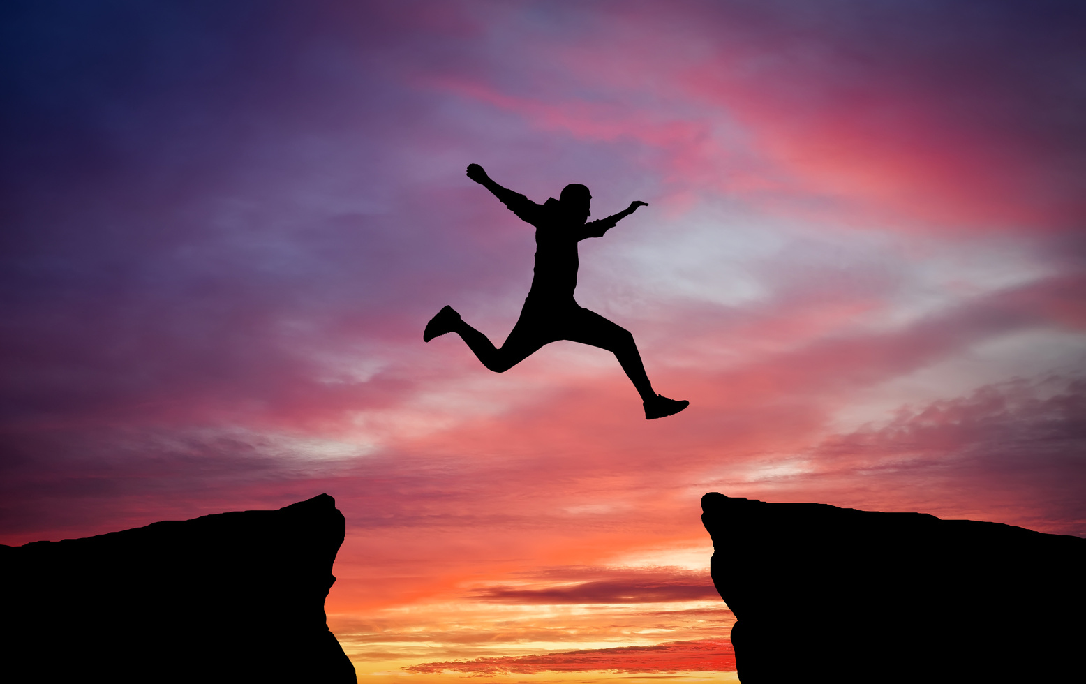Man jumping across the gap